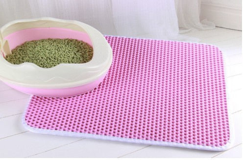 Waterproof cat litter mat in use with a cat pink